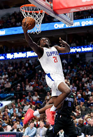 Nov 10, 2023; Dallas, Texas, USA; LA Clippers guard Kobe Brown (21) shoots during the second half against the Dallas Mavericks at American Airlines Center.